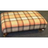 A substantial tartan wool stool in tones of orange and cream