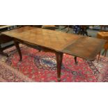 A contemporary French drawleaf dining table , parquetry inlay,