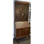 An early 20th century mahogany bureau bookcase, astral glazed panel doors,