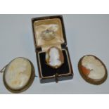 A cameo brooch; another;