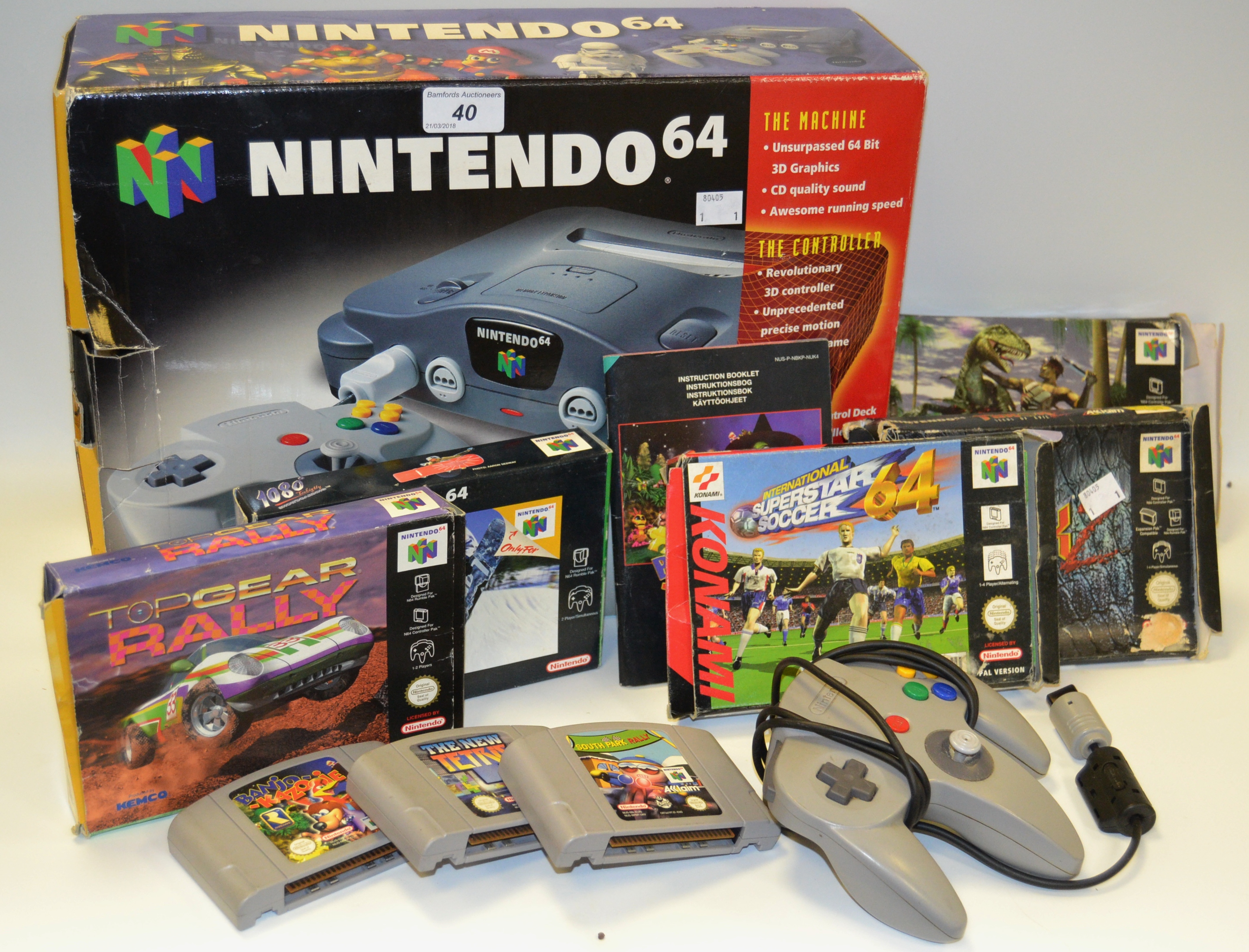 A Nintendo 64, boxed, two controllers, instruction manuals and games,