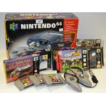 A Nintendo 64, boxed, two controllers, instruction manuals and games,