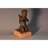 Italian School (19th century), a dark patinated cabinet bronze, of a putto, marble base,