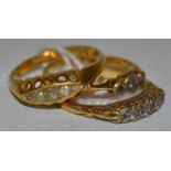 A five stone graduated diamond ring, 18ct gold shank; another, three stone; etc, 6.