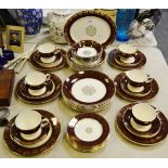 A Midwinter Stylecraft Classic shape part dinner and tea service, maroon border.