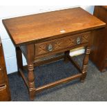 An 18th Century style oak hall table, oversailing top, one carved drawer to frieze,