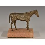 An early 20th century silvered desk model, of a thoroughbred horse, rectangular rose marble base,