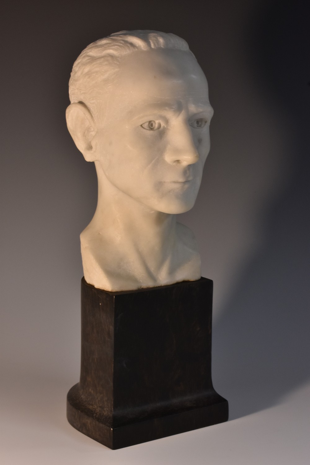 A white marble library bust of a gentleman, plinth base, 27.