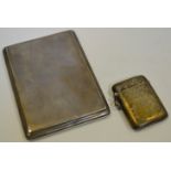 A silver vesta case, chased and engraved overall, Birmingham 1924, 31.