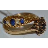 A garnet and diamond chip cluster ring, 9ct gold shank; a blue stone and diamond chip ring,