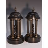 A pair of late 19th century dark patinated and belge noir library porticos,