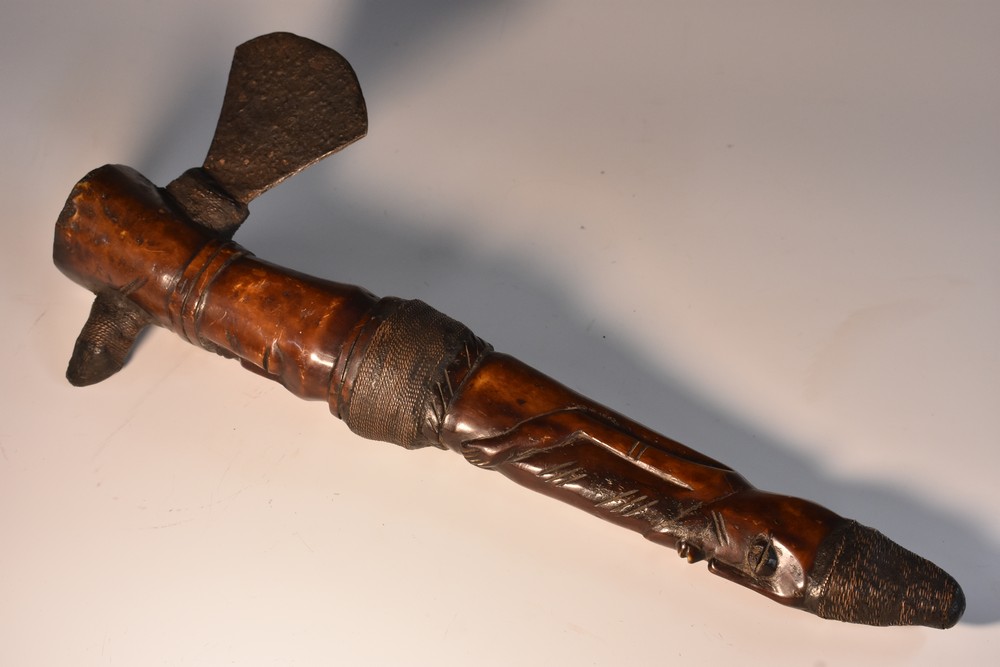 Tribal Art - an African axe, probably Yoruba, the bone shaft carved as a stylised figure,