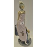 A Lladro figure of a Lady in early 20th century attire,