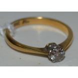 A diamond solitaire ring, 1/8th carat, 18ct gold shank 1.