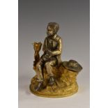 A 19th century gilt and silvered bronze novelty inkwell, cast as a well dressed young man,