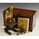 A 19th century black painted and lacquered brass monocular microscope,