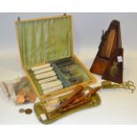 Ephemera - an early 20th century metronome ; a brass candle snuffer and tray; coins;
