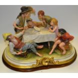 A Capodimonte figural group, The Magician, signed to base, B Merli,