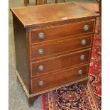 A Sheraton Revival chest of four long crossbanded satin wood inlay drawers,