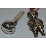 A child's silver rattle,