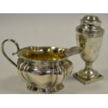 A George III style silver pepper pot, of urnular form,