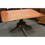 An early Victorian mahogany canted rectangular dining table (lacking tilt mechanism)