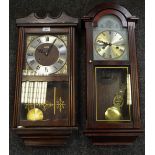 A mid/late 20th Century mahogany drop pendulum wall clock;