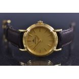 Jaeger le Coultre - a lady's 18ct gold wristwatch, brushe gilt dial , block batons,