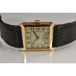 An Art Deco 9ct gold wristwatch, square silvered dial, stylized Arabic numerals, minute track,