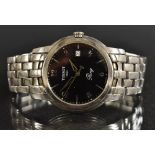 Tissot - a ring wristwatch, black dial, raised alternate Arabic numerals and block baton markers,