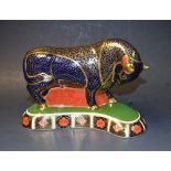 A Royal Crown Derby paperweight, Bull, the kidney shaped base printed in the 1128 Imari palette,