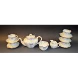 A Charles Wiseman part tea set decorated with lilac and green daisies comprising teapot, cream jug,