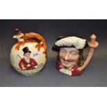 A Crown Devon musical jug, John Peel, fox handle, with movement; a Royal Doulton character jug,