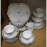 A Shelley tea service, Art Deco style pattern on white ground, six tea cups, twelve saucers,