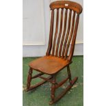 A Victorian beech and elm lath back rocking chair C1860