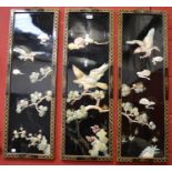 Three Oriental lacquer plaques with mother of pearl birds and foliage