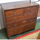 A George III oak chest of drawers, two short cockbeaded drawers over three graduated long,