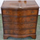 A walnut serpentine fronted chest of drawers