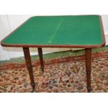 A Regency mahogany card table, fold over top, opening to green baize playing surface, tapering legs,