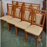 A set of eight modern pine dining chairs