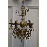 An early 20th century decorative brass six branch chandelier