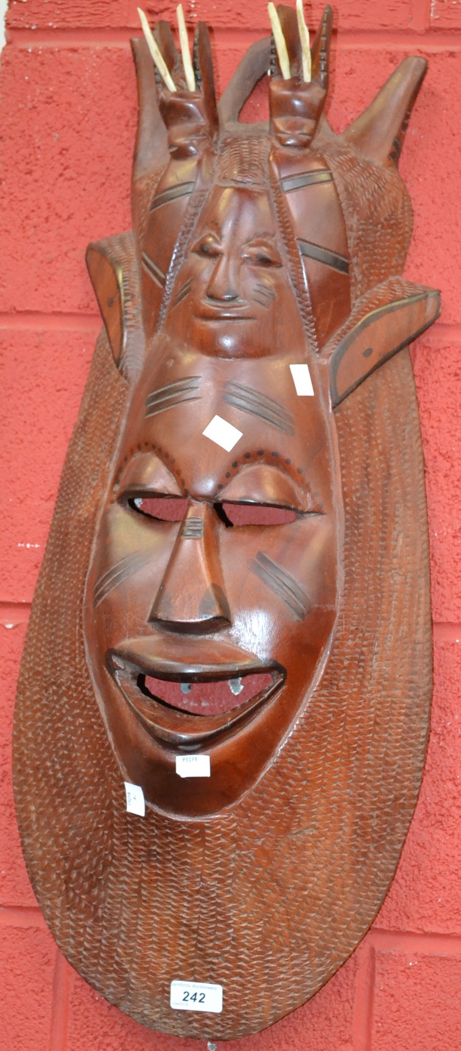Tribal Art - an African carved hardwood mask,