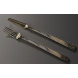 An Art Deco silver knife and fork, geometric terminals, the former 17cm long, Charles Boyton,