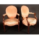 A pair of George III French Hepplewhite mahogany elbow chairs, curved oval backs,