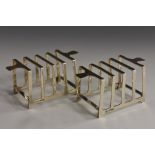 A pair of Art Deco silver five-bar toast racks, geometric lug handles, 11cm wide, Mappin & Webb,