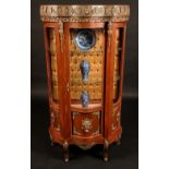 A Louis XV style gilt metal mounted mahogany serpentine vitrine,