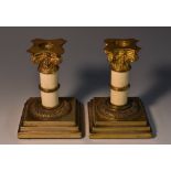 A pair of 19th century gilt metal and ivory Corinthian boudoir candlesticks, detachable sconces,