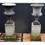 A pair of Neoclassical design composition half-fluted campagna garden urns,