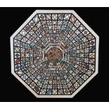 A pietra dura octagonal table top, inlaid in malachite, lapis lasuli, Sienna,