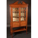 An Edwardian satinwood crossbanded mahogany display cabinet,